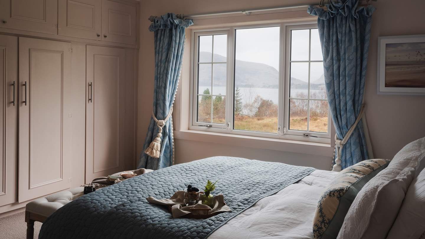 A super king bed resides in quilted harmony in the first bedroom