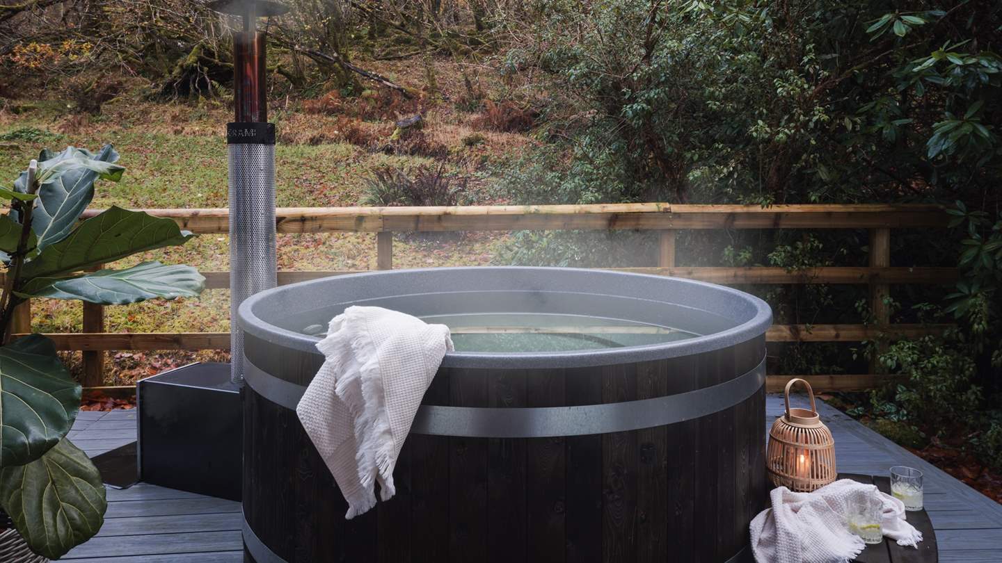 A wood-fired hot tub awaits for relaxing moments alfresco 