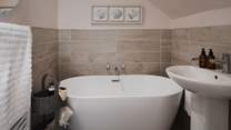 You'll also find a sweet ensuite bathroom, with a deep tub for soul-soothing soaks 
