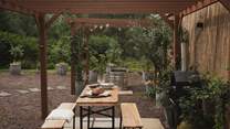 A picnic bench tempts for formal alfresco feasts and starlit soirées