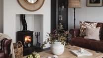 Bathed in natural light from large windows and warmed by a wood burning stove, this heavenly space is perfect for slow moments 