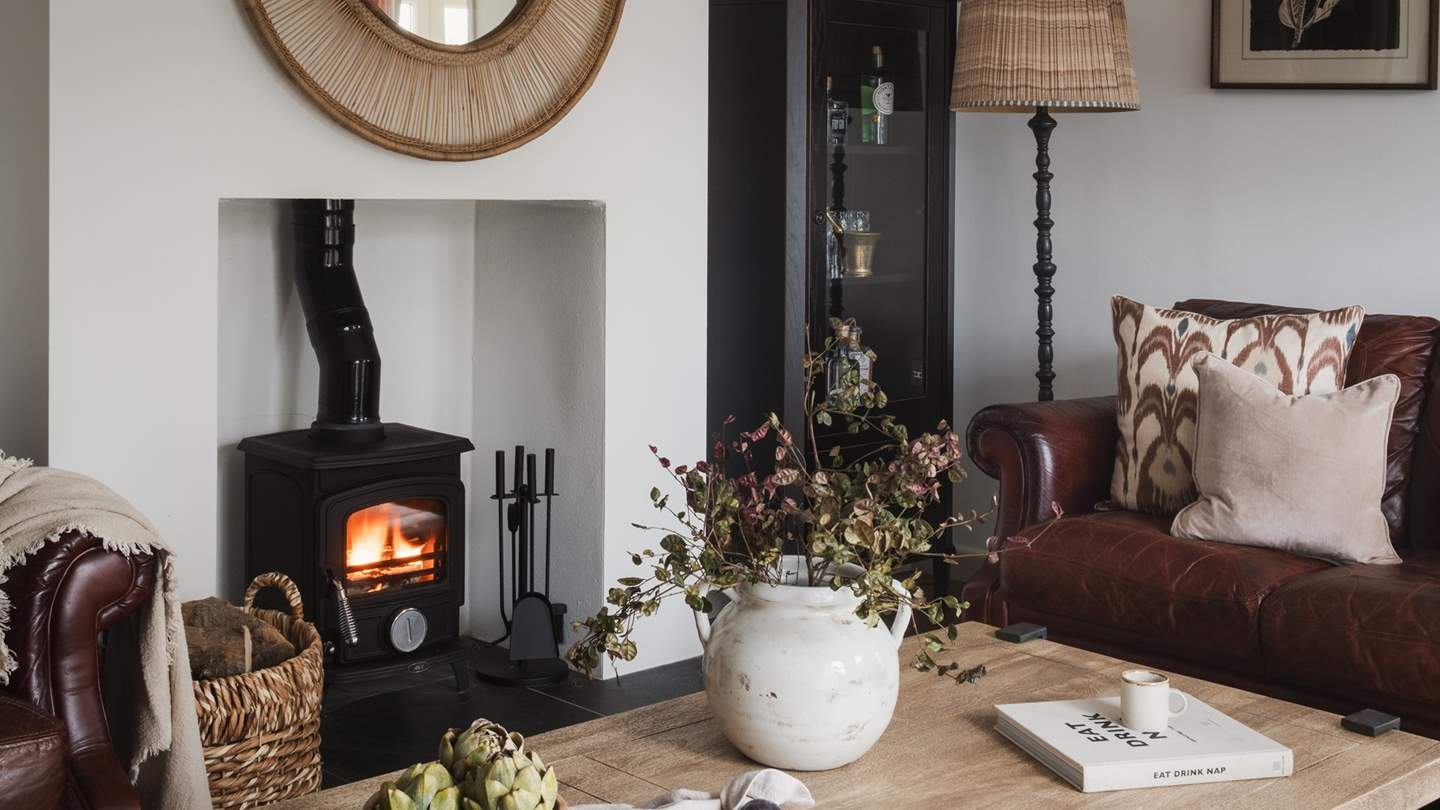 Bathed in natural light from large windows and warmed by a wood burning stove, this heavenly space is perfect for slow moments 