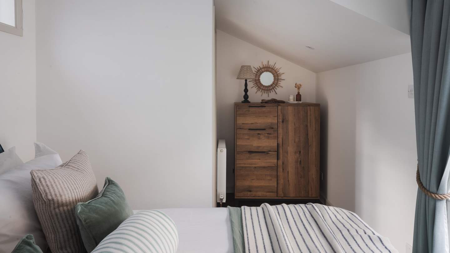 For storage, there is a small wardrobe and chest of drawers for your belongings 