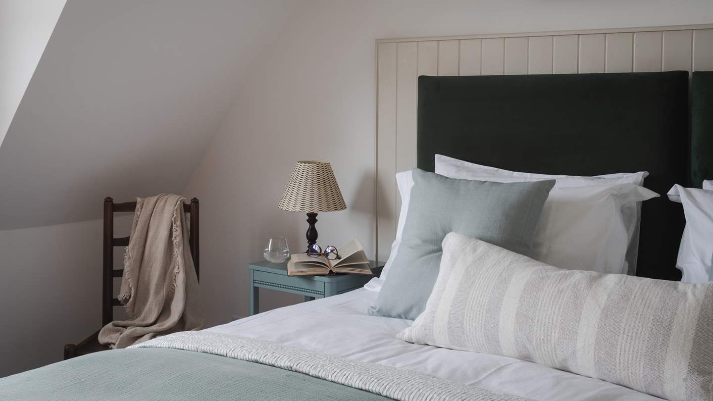 With nautical inspired tones and décor, this space welcomes restful slumbers 