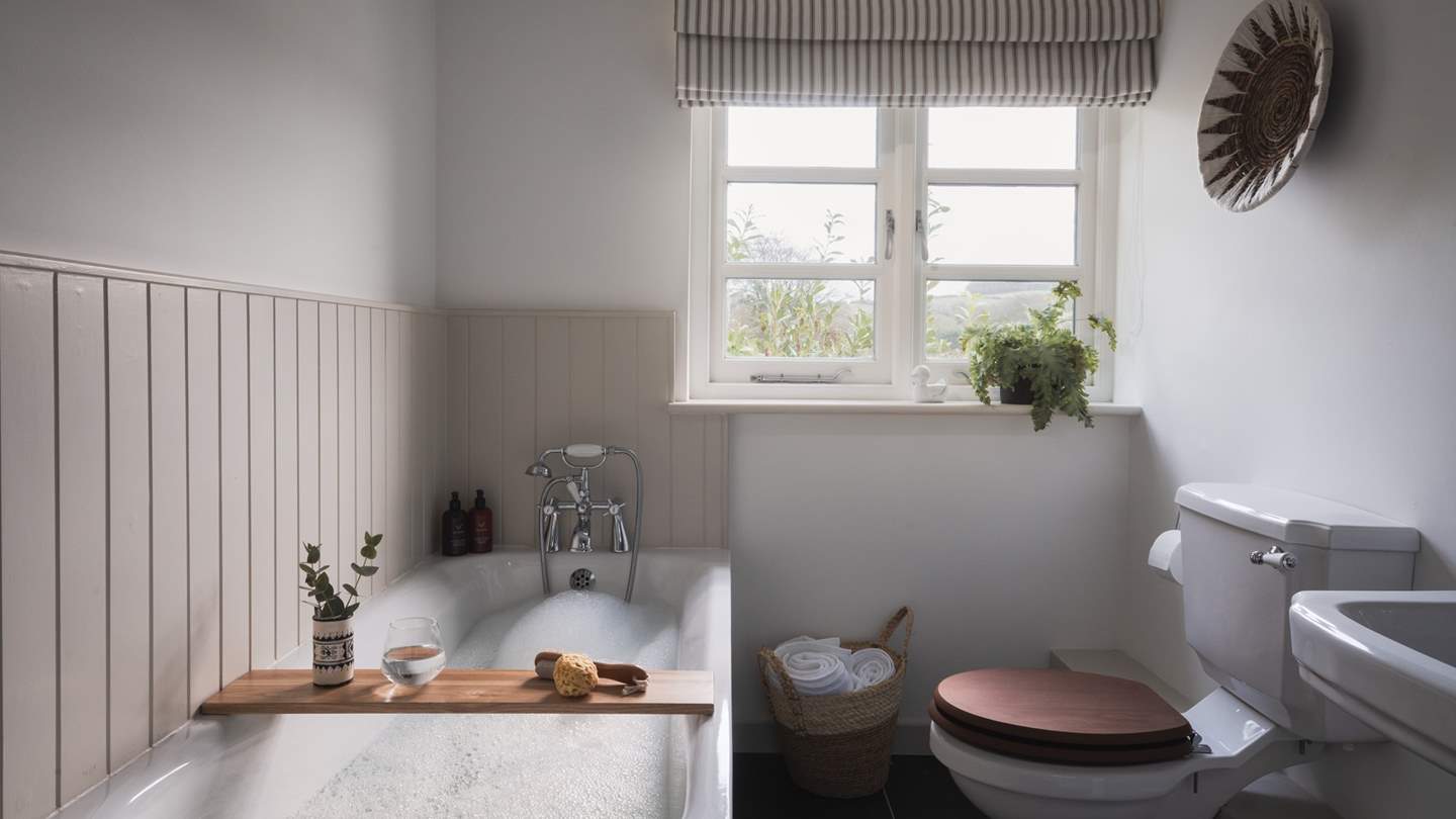 Equipped with both a bath and a separate shower for soothing soaks