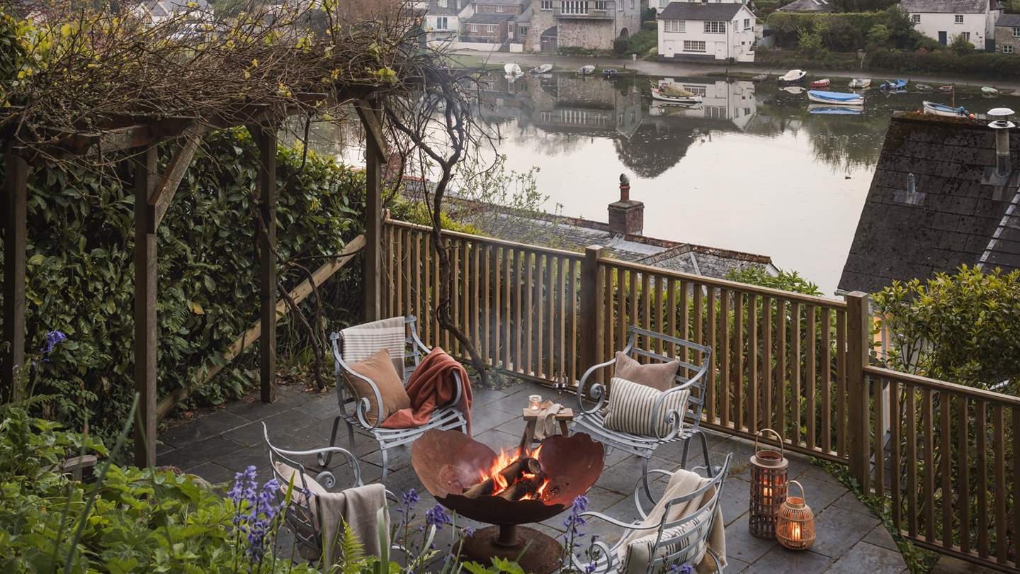 Gather around the outdoor firepit ready to be warmed by the amber glow