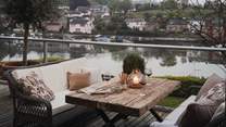 The first floor promises the best of outdoor living with a river-view sundeck