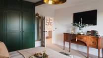 You’ll also find a double wardrobe, decorated in Farrow & Ball’s soothing shade of Green Smoke