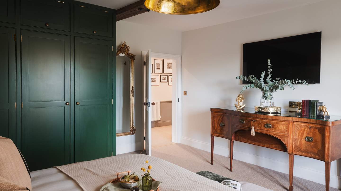You’ll also find a double wardrobe, decorated in Farrow & Ball’s soothing shade of Green Smoke