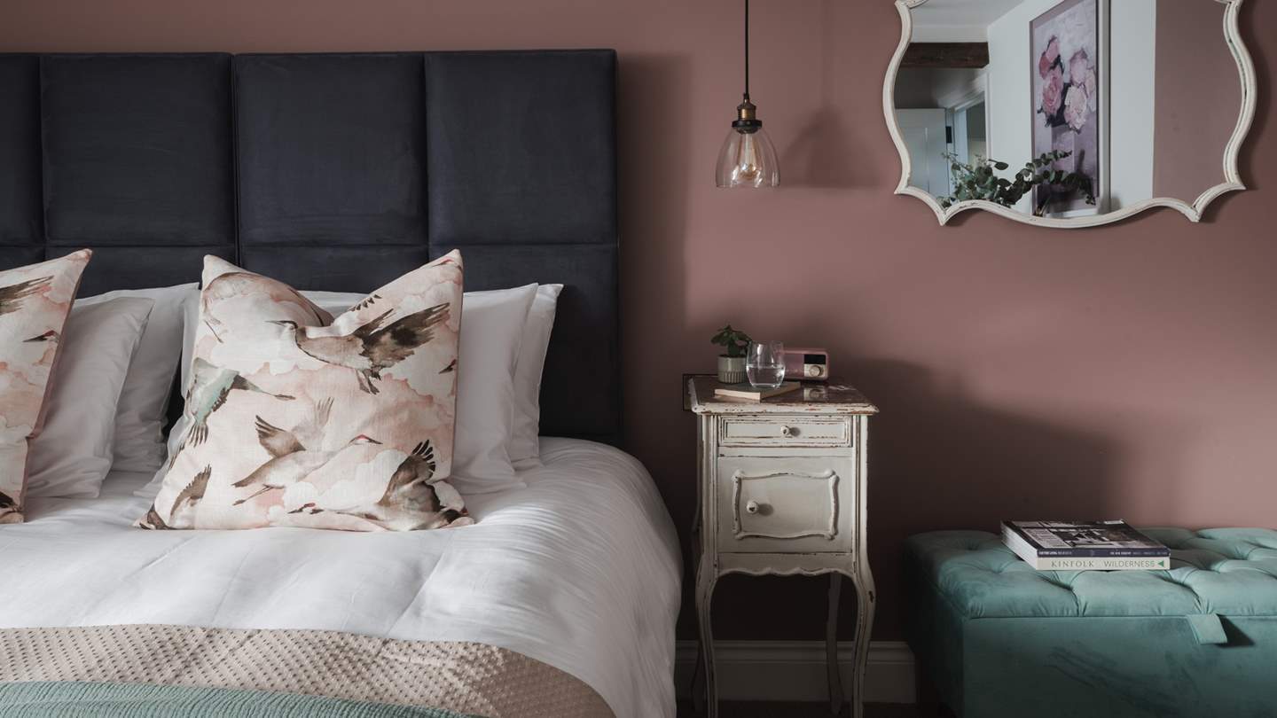 Full of charm, it features a slanting ceiling graced with exposed timbers and pendant lighting for added ambience