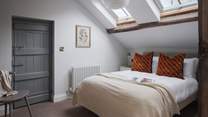 The ninth bedroom is a welcome space, inviting for luxurious rest and relaxation