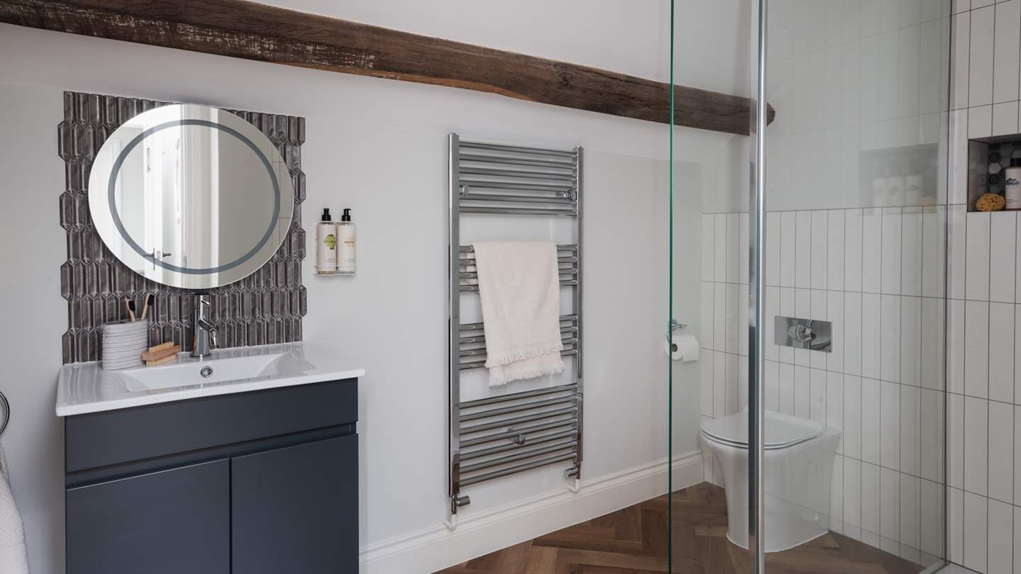 Completing the picture is an ensuite bathroom with a walk-in, waterfall shower