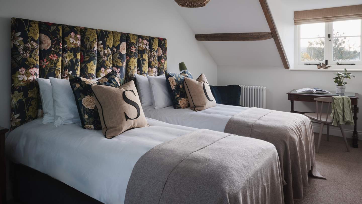 With floral bespoke headboard for nights of serene slumber, the seventh bedroom offers a super king zip-and-link bed that can also be arranged as two large singles 