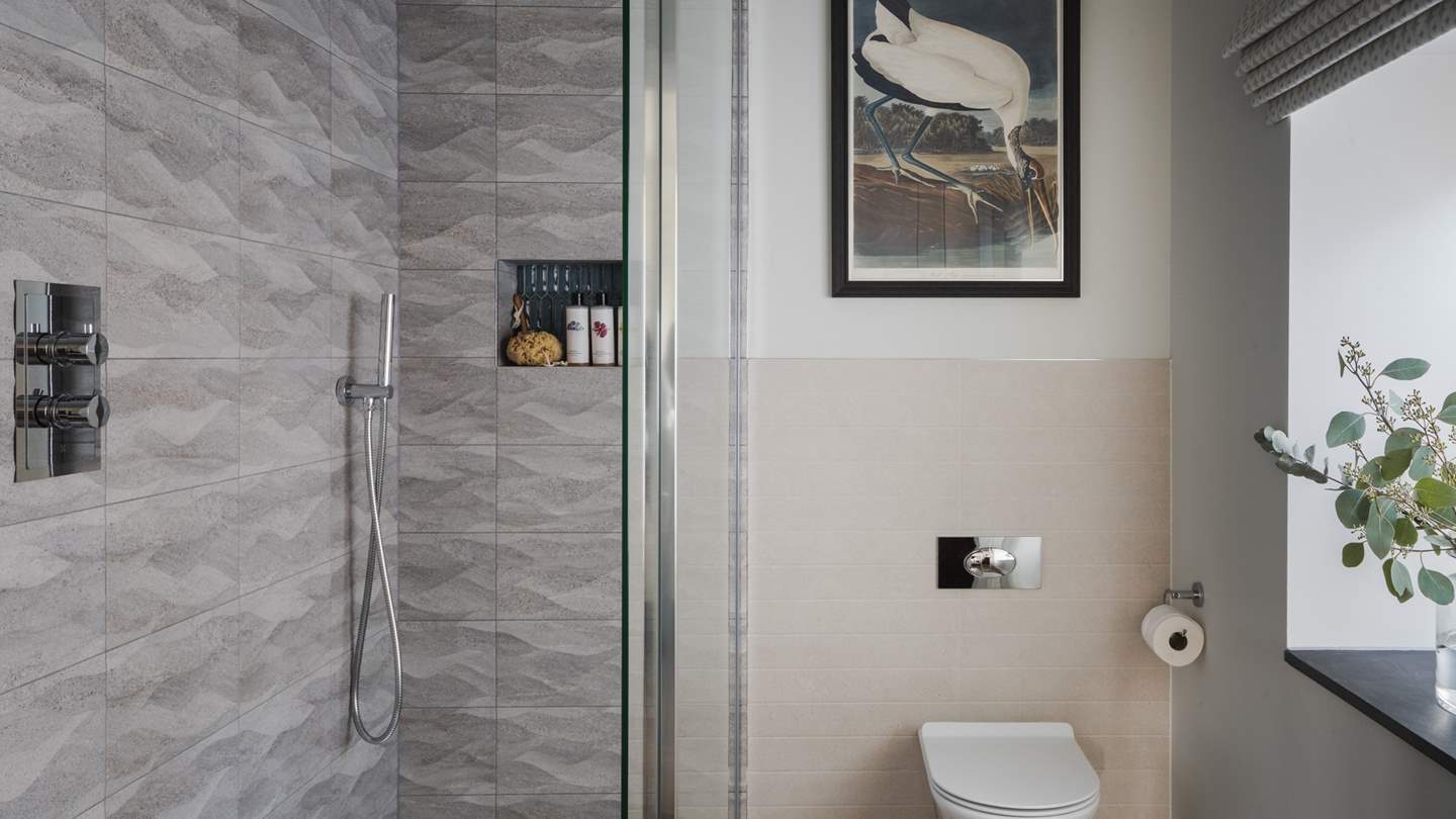 Enjoy refreshing ablutions in the ensuite shower room