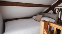 Upstairs, a single bed nestles within the eaves and calls for the sweetest slumbers