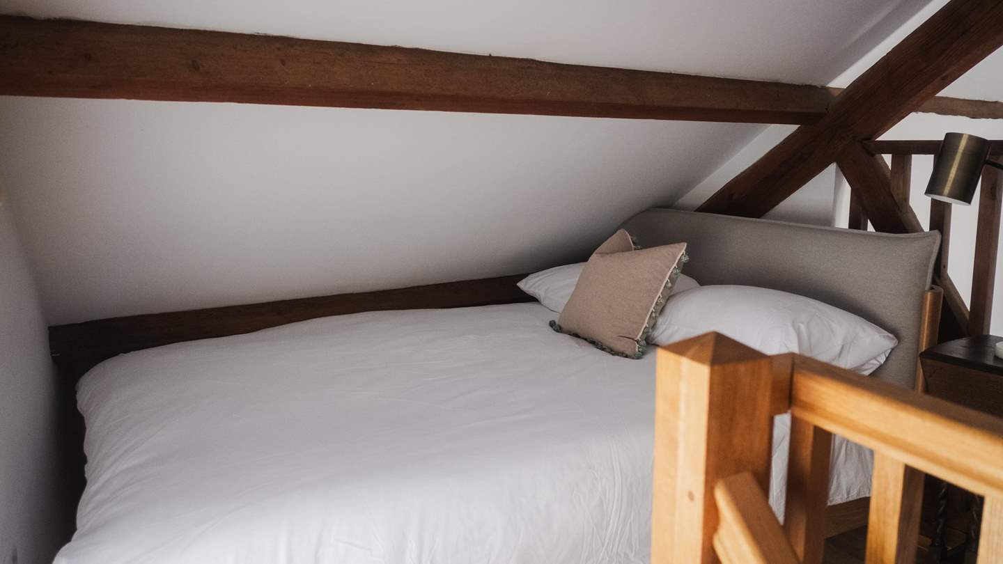 Upstairs, a single bed nestles within the eaves and calls for the sweetest slumbers