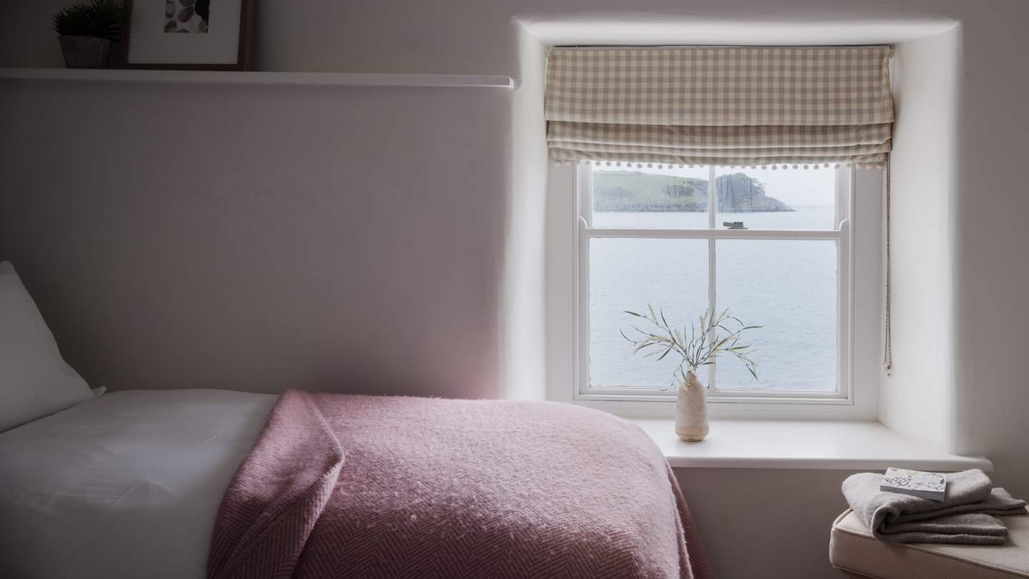 Pretty as a picture, it is brushed with a peaceful palette and stars an alcove cottage window with uninterrupted views over the water and St Anthony Head beyond