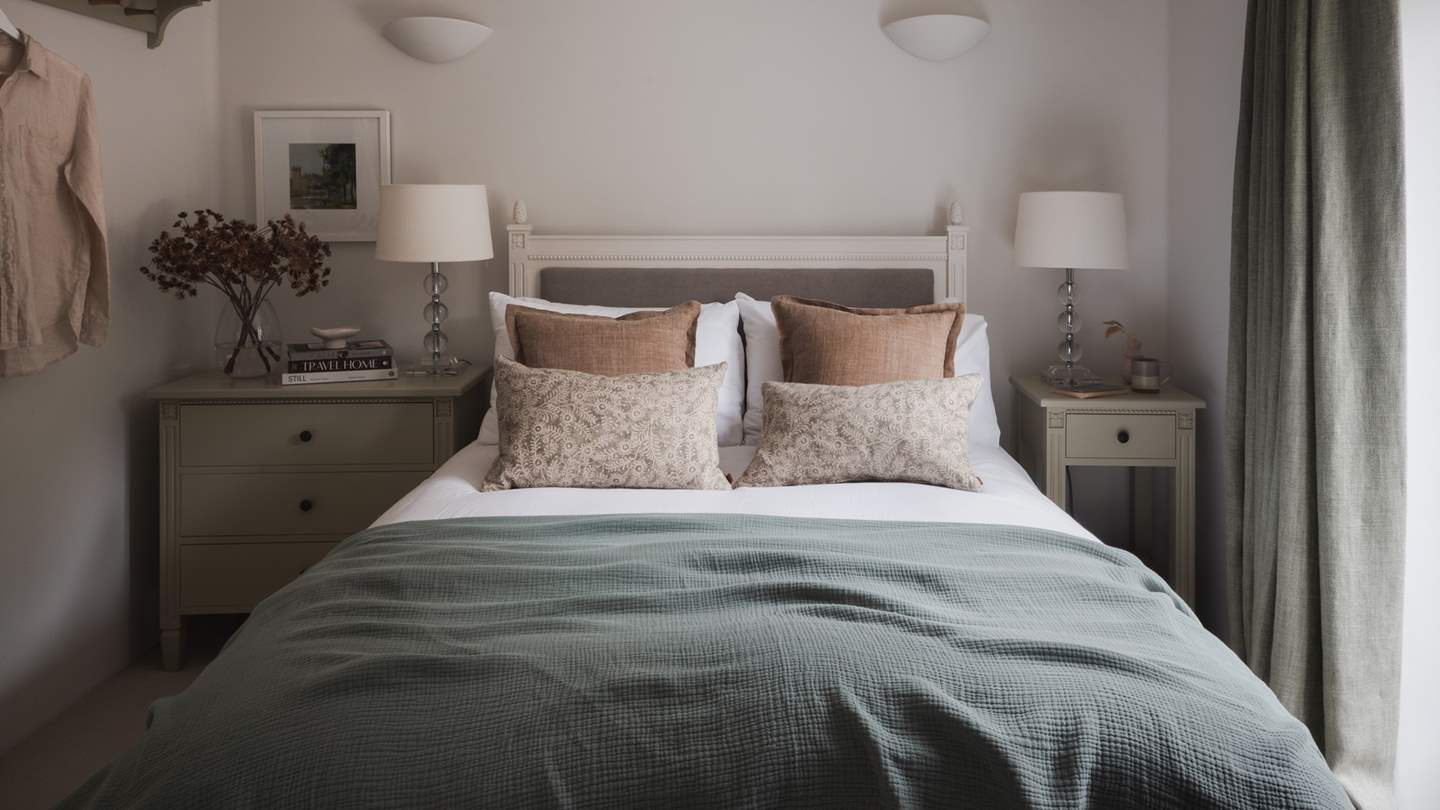 Beckoning for nights of restful repose, the light-filled third bedroom awaits with a beautiful Larsson double bed dressed in the finest linens