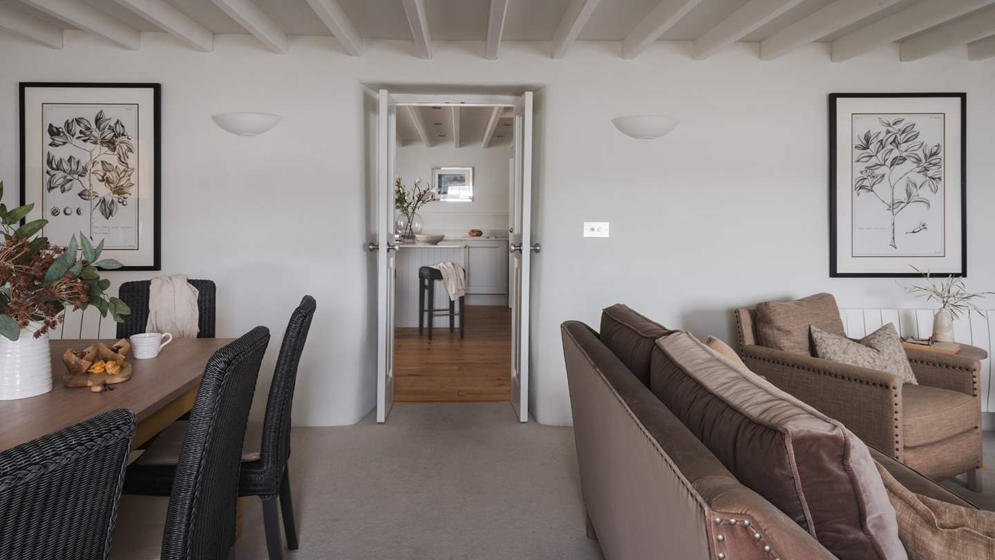 In an open-plan design curated for comfort by Neptune, the lounge is bathed in sunlight and layered lighting