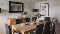 The dining table provides space for all the family and presents a beautiful setting for meals together
