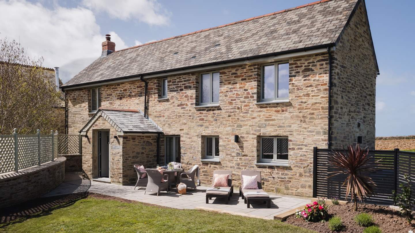 Relax on the manicured lawn with a picnic spread, gather around the outdoor dining table for feasting, or venture beyond the garden to explore the grounds of Trevear Estate