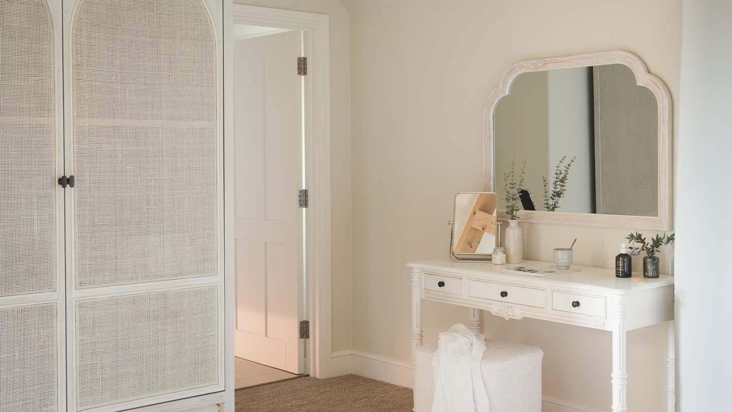 Creamy tones and soft natural textures make this a dreamy dressing area