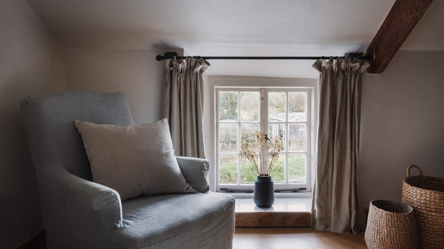 Along with a plump armchair, there is plenty of space for the lovers of morning yoga