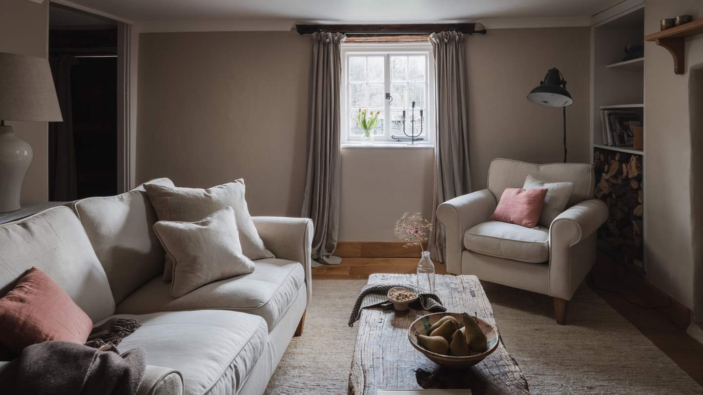 Calm and considered, the space is adorned with textiles in muted tones