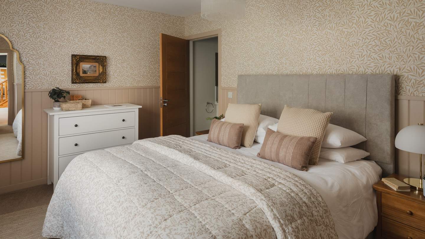 The first bedroom on the ground floor is endlessly romantic, with soft creams and pale ochre hues