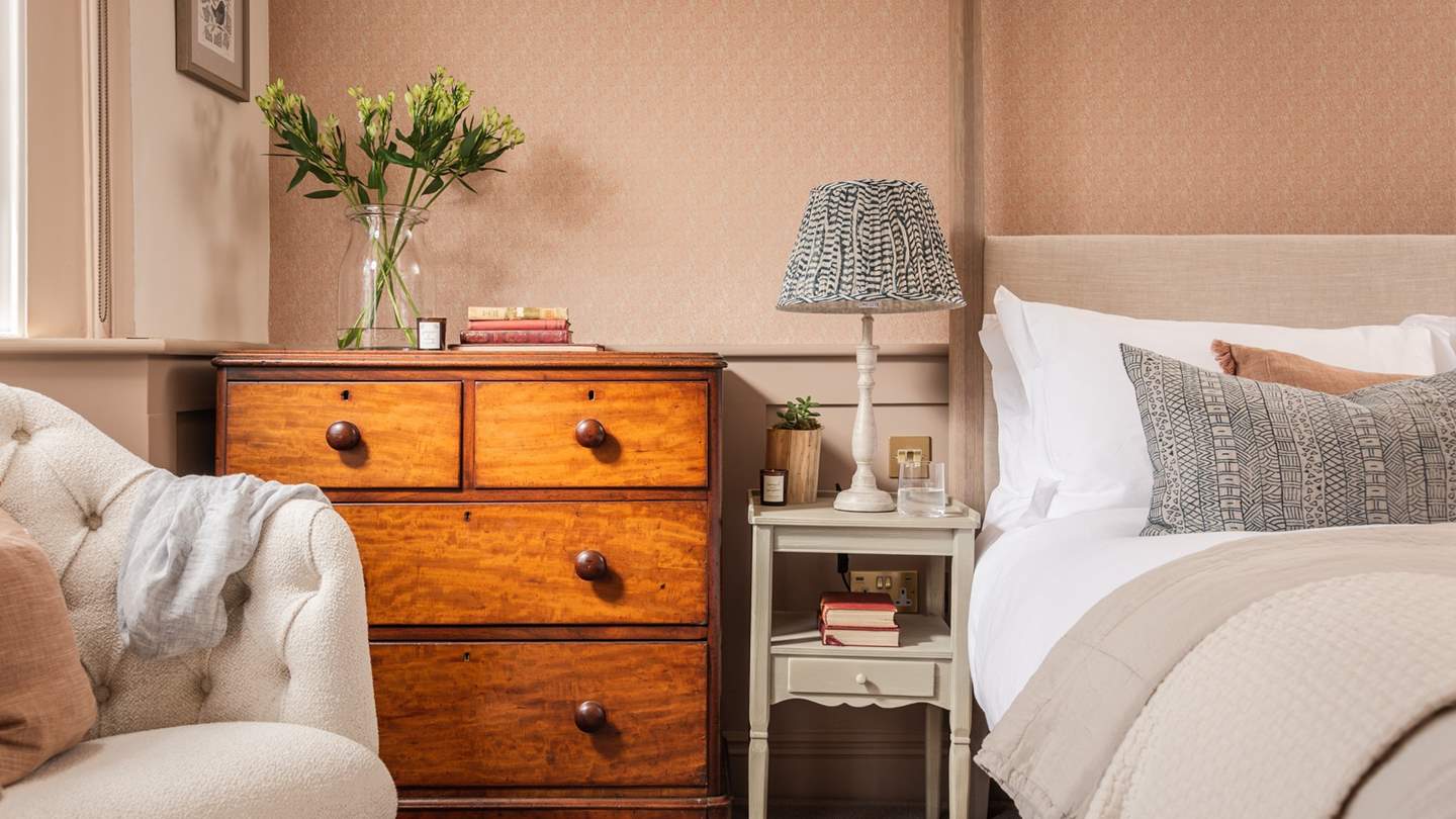 Enjoy lie-ins in the king-sized four poster bed by Neptune