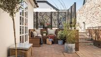 Relax in the courtyard, with a designated L-shaped seating area 