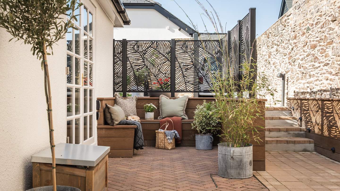 Relax in the courtyard, with a designated L-shaped seating area 