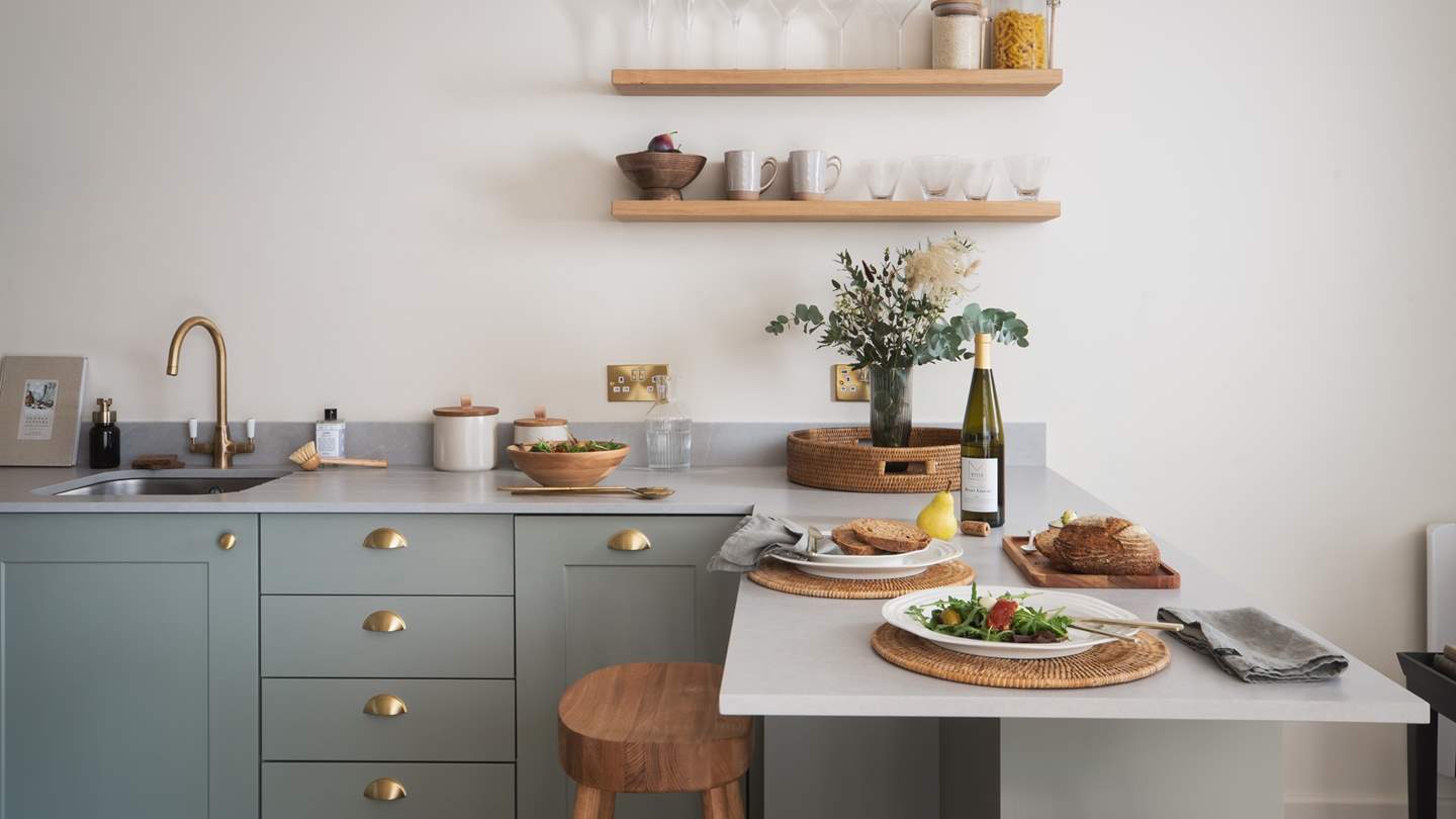 Uncover ample space for prepping your chosen dish with local treats, plus a lovely stone counter bar with oak stools rests between the kitchen and lounge area