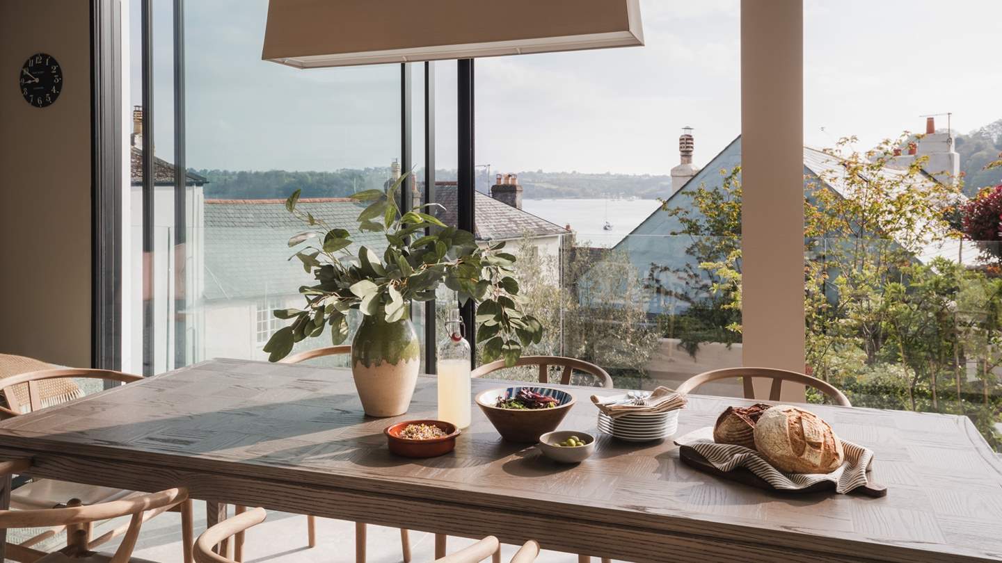 Complete with a large dining and ten natural wood wishbone chairs, ensuring a heavenly space for feasting