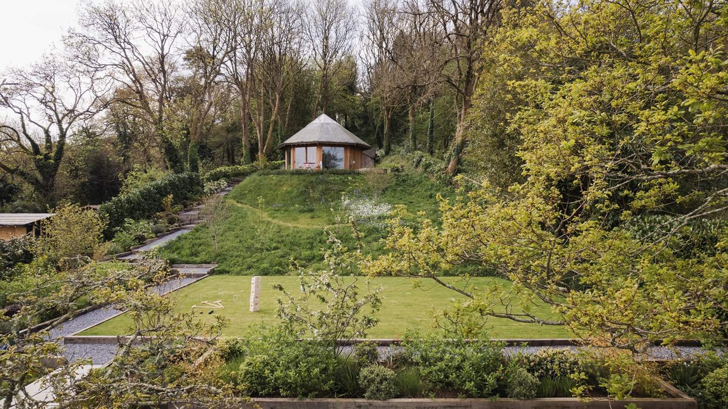 Set on the highest tier is the Garden House, complete with a stunning decked terrace with a bistro table, along with the cedar wood hot tub 