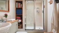 There is also a luxurious shower room, plus a separate changing room off the living area for accessing the pool with ease