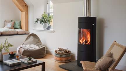 Cosy up with a book beside the wood burning stove, or simply soak up the views unveiled before you