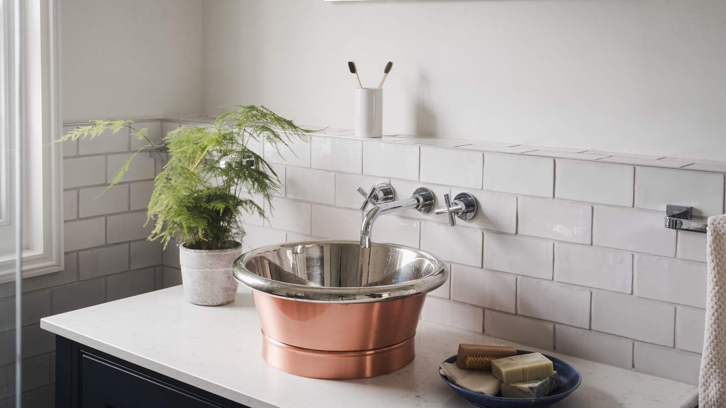 This ensuite also enjoys a heated towel rail and flooring for the utmost comfort