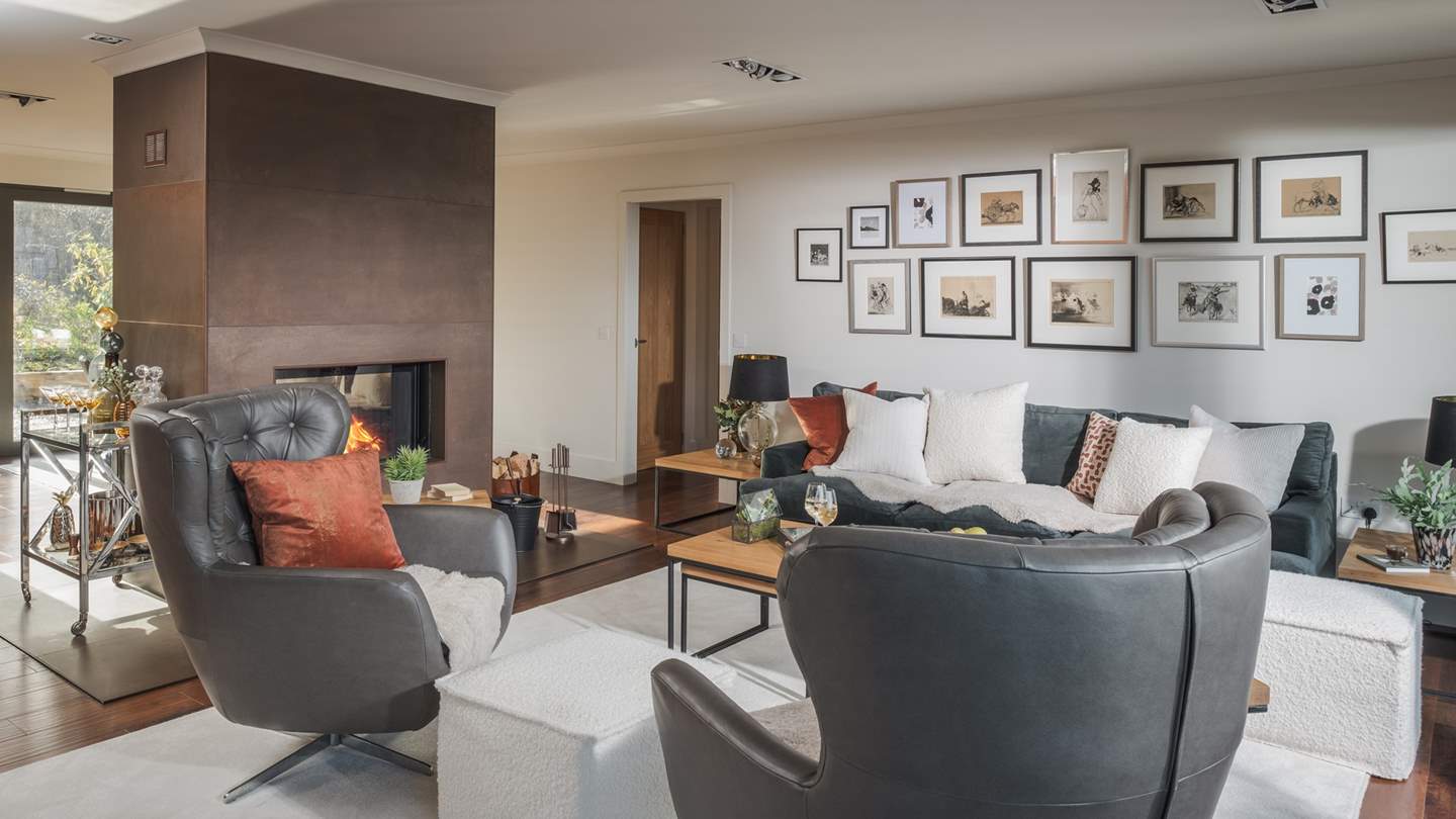 There’s ample seating for four, with the addition of two armchairs beside a modern rustic coffee table