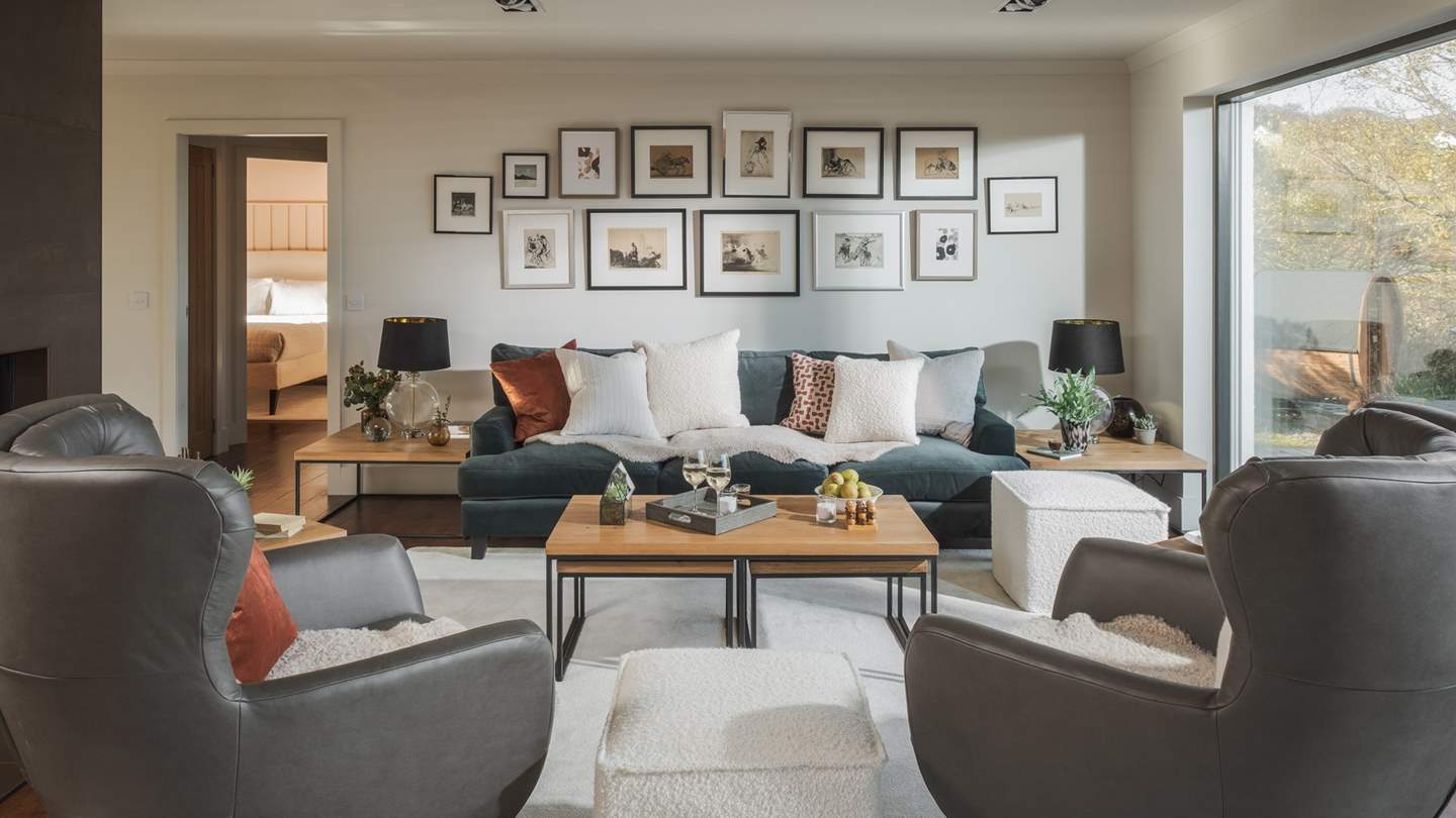 In a palette of earthy tones, the living area invites for cosy evenings settled on the sofa