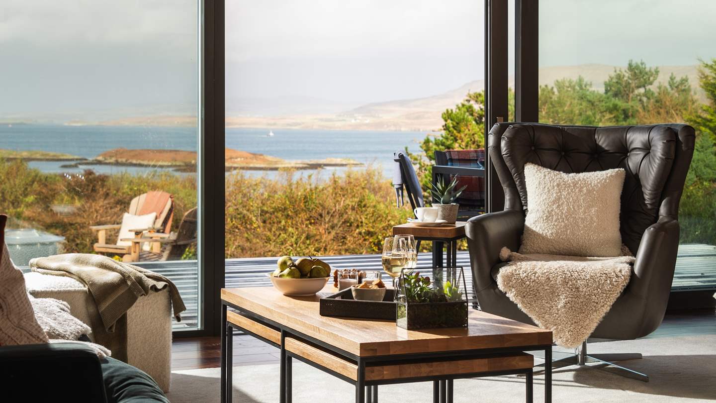 The seamlessly designed open-plan living and dining space ensures the breathtaking backdrop can be savoured at every turn