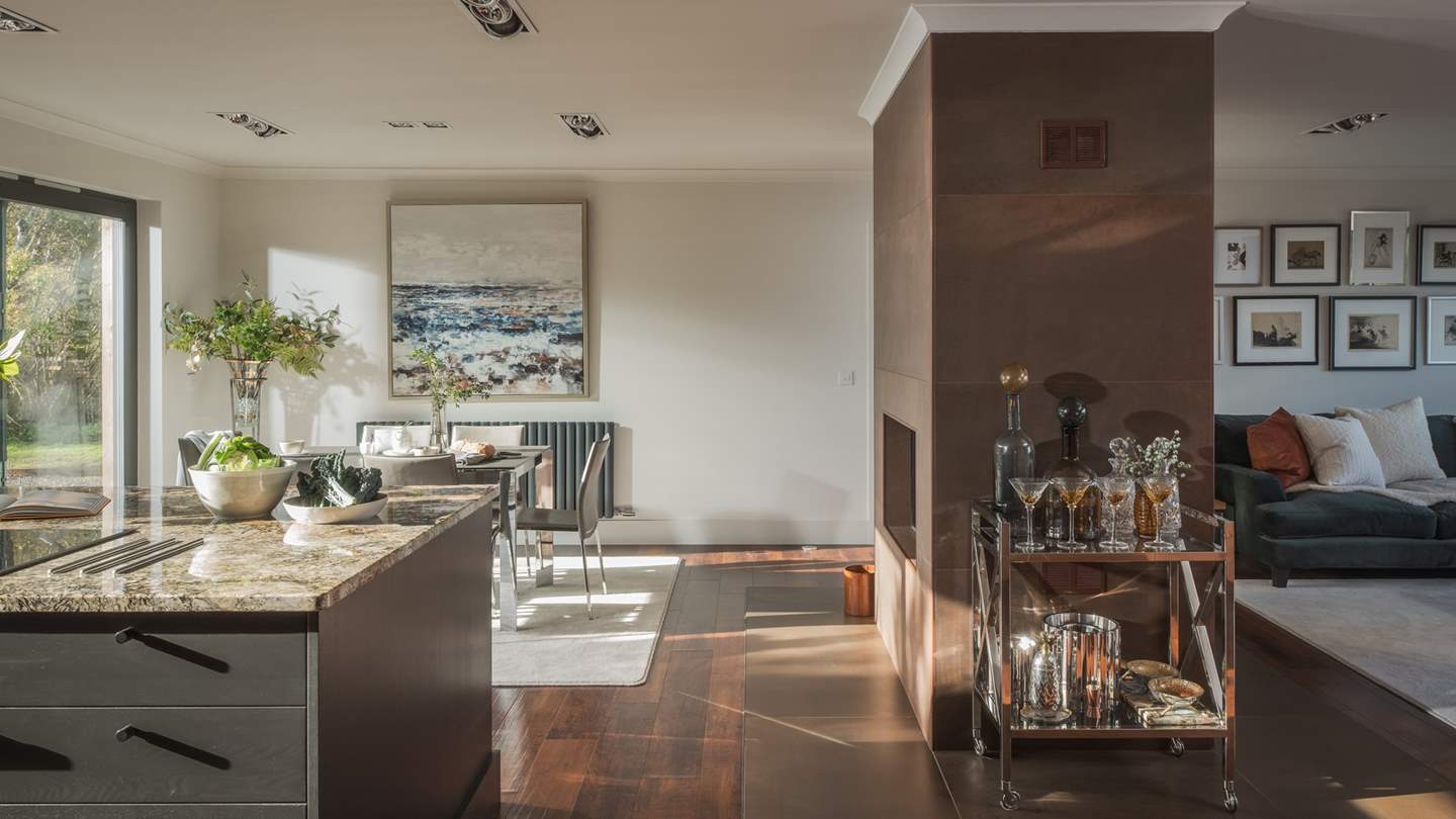 At the other side of the kitchen, there’s a modern dining table for six