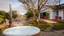 Embraced by a secluded leafy canopy, uncover the Scandinavian wood-fired hot tub 