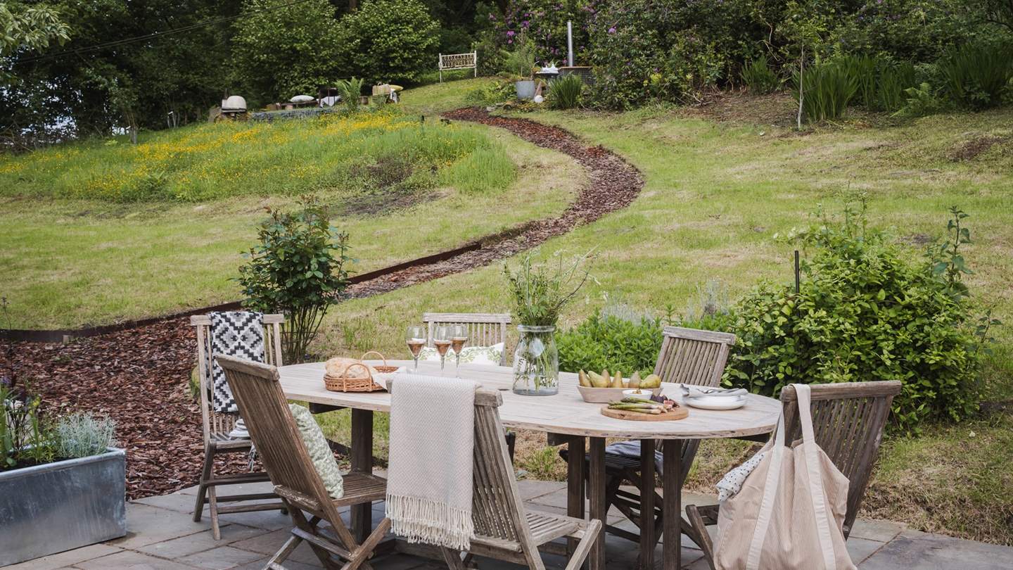 The garden is split across two levels, connected by a gently sloped path