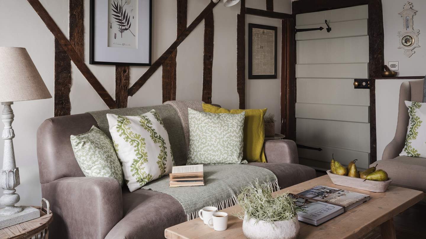 There’s ample space for gathering, with a comfortable sofa and two armchairs either side