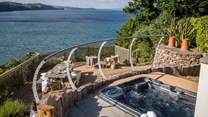 Settle into the hot tub to admire the roll of the waves beyond Cobalt...