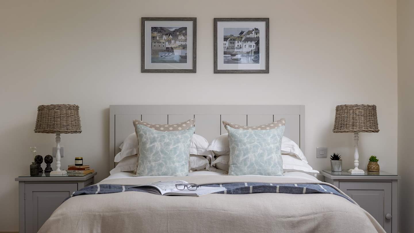 The king size bed adorned in the finest linens