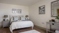 Situated on the lower ground floor, the stunning third bedroom with its own patio is a picture of serenity