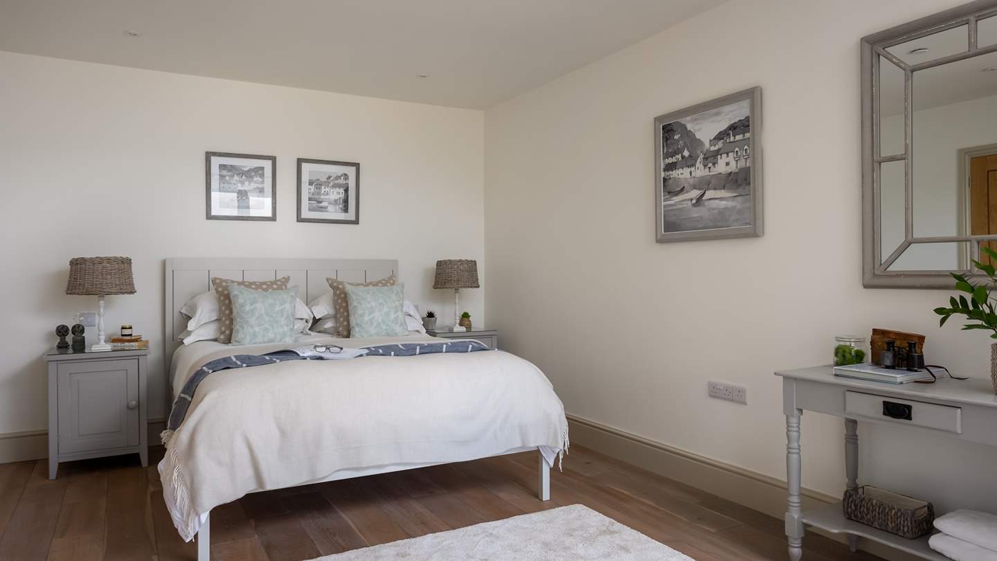 Situated on the lower ground floor, the stunning third bedroom with its own patio is a picture of serenity