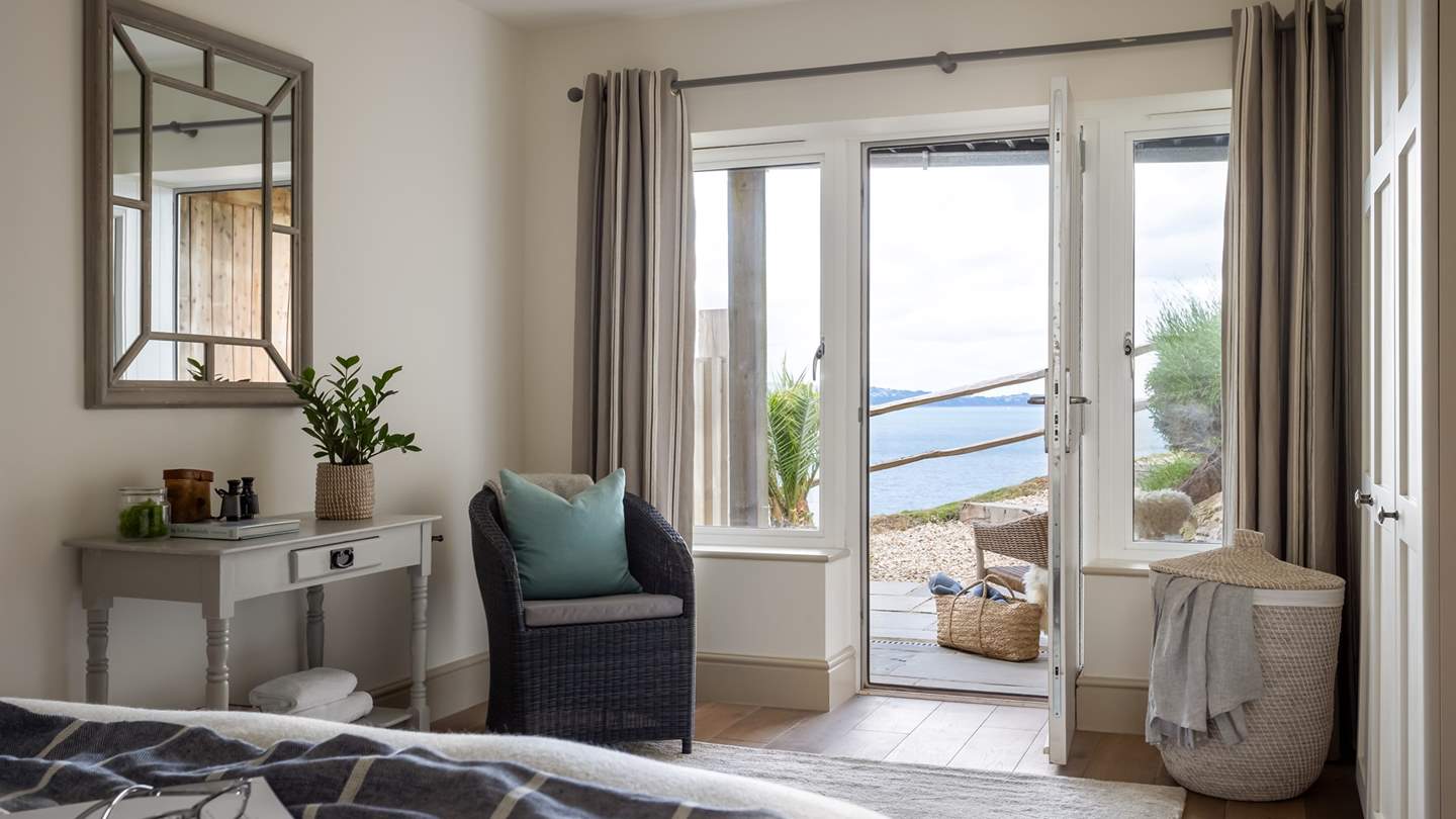 Enjoying subtle nautical inflections, this bedroom promises nights of blissful slumber 